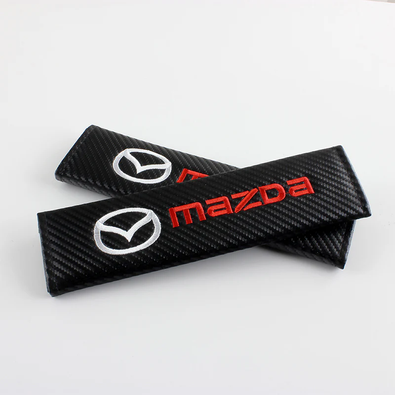 Mazda Set of Carbon Fiber Look Embroidered Armrest Cushion & Seat Belt Cover - Image 3