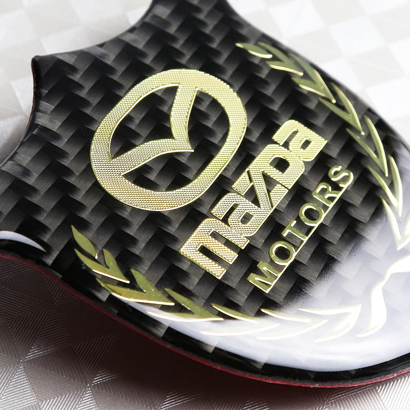 Mazda Gold 3D Carbon Fiber Emblem Sticker x2 - Image 2